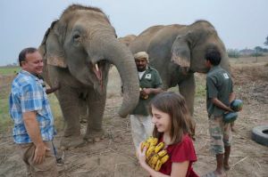Craig and Bela feeding elephants